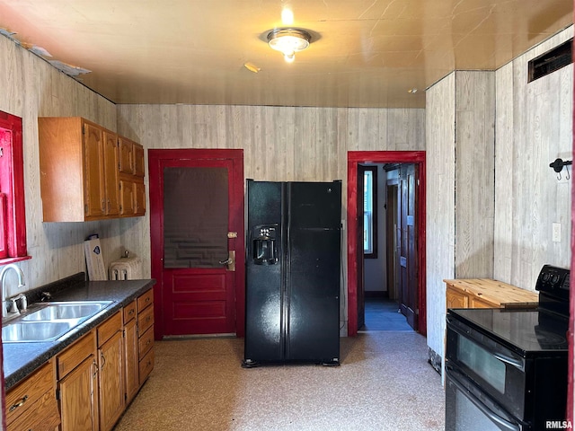 kitchen featuring black appliances and sink