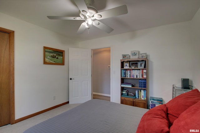 carpeted bedroom featuring ceiling fan