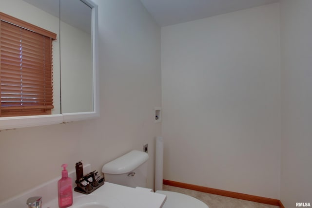 bathroom featuring sink and toilet