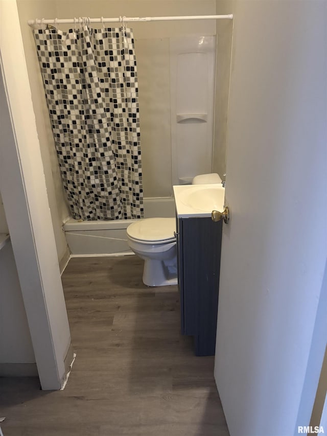 bathroom featuring vanity, hardwood / wood-style flooring, and toilet