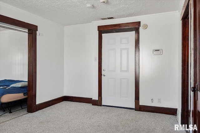 carpeted bedroom featuring a textured ceiling