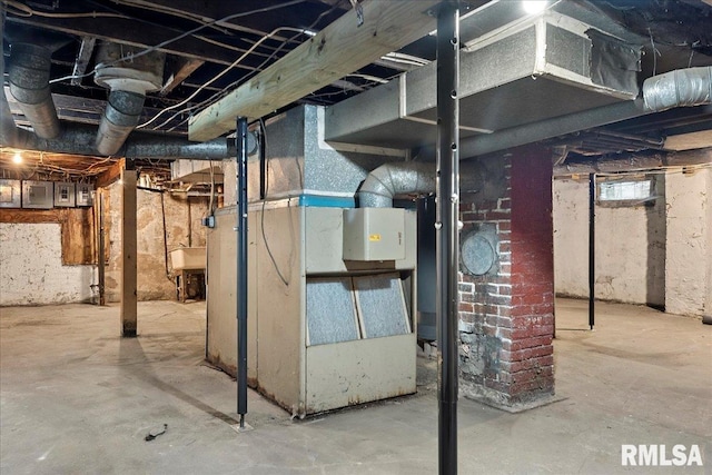 basement with electric panel and sink