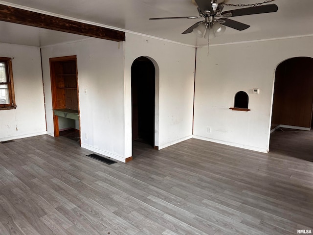 empty room featuring crown molding, ceiling fan, and wood-type flooring