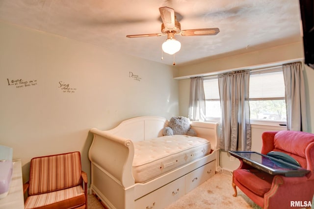 bedroom with ceiling fan and carpet