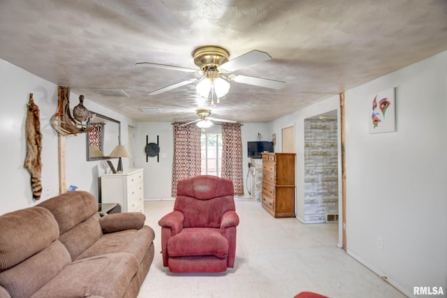 living room featuring ceiling fan