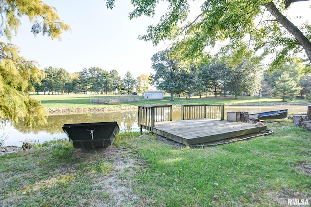 exterior space with a deck with water view