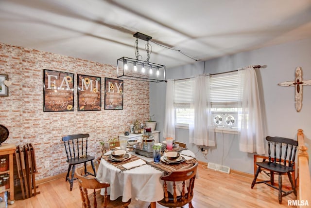 dining area with light hardwood / wood-style floors