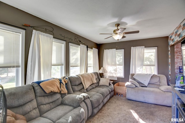 living room featuring ceiling fan and light colored carpet