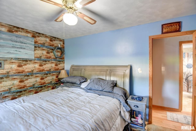 bedroom featuring ceiling fan and light hardwood / wood-style floors