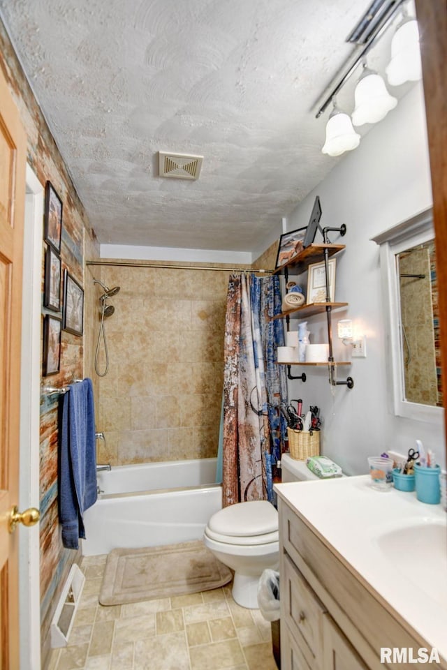 full bathroom with shower / bathtub combination with curtain, vanity, and toilet