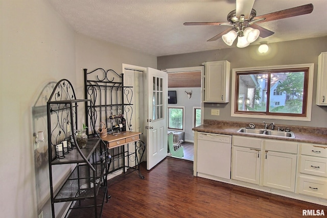 kitchen with white dishwasher, white cabinets, sink, and dark hardwood / wood-style flooring