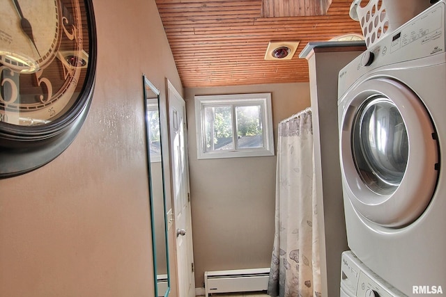 laundry area with wooden ceiling, a baseboard radiator, stacked washing maching and dryer, laundry area, and baseboard heating