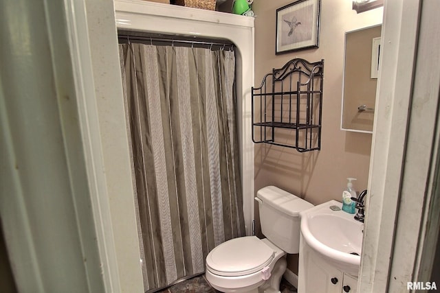 bathroom featuring sink and toilet