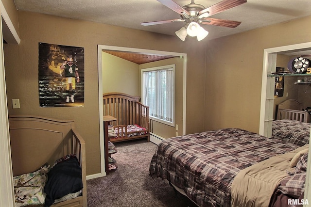 carpeted bedroom featuring ceiling fan, a textured ceiling, and a baseboard heating unit