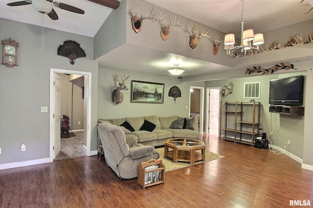living room featuring ceiling fan with notable chandelier, high vaulted ceiling, visible vents, wood finished floors, and baseboards