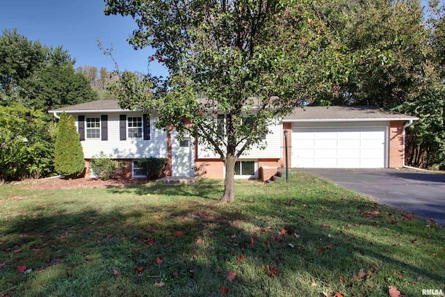 view of front of home featuring a garage and a front lawn