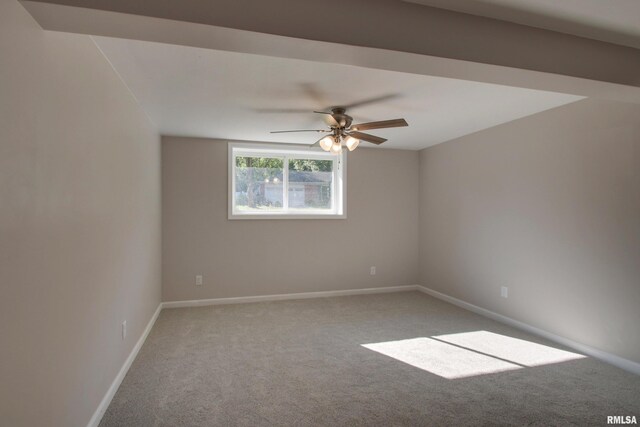 unfurnished room with ceiling fan and carpet flooring