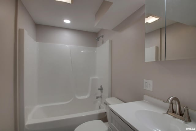 full bathroom featuring vanity, washtub / shower combination, and toilet