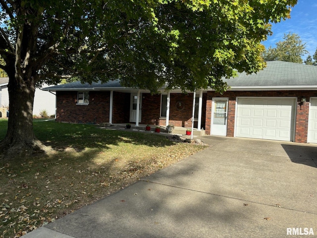 ranch-style home with a garage and a front lawn