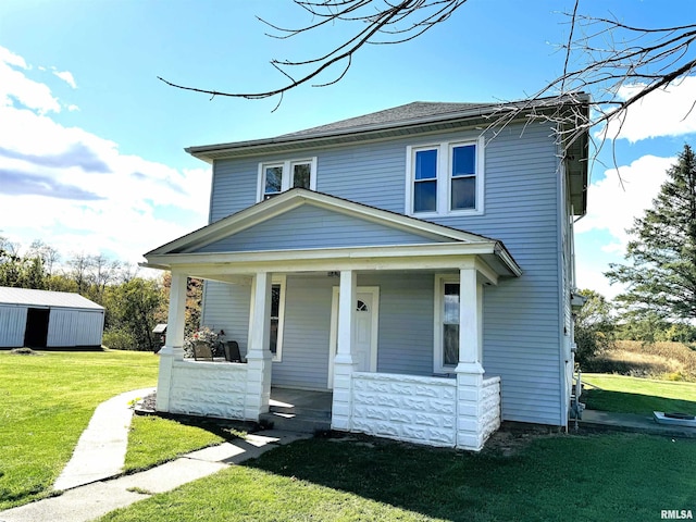 view of front of home with a porch and a front lawn