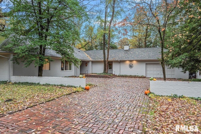 single story home with a garage