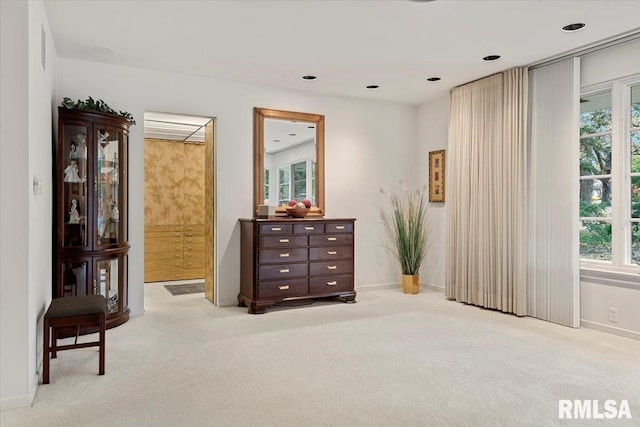 sitting room featuring light colored carpet