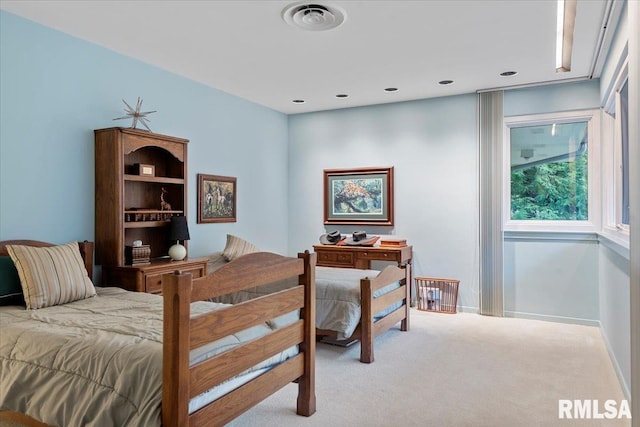 bedroom with light carpet