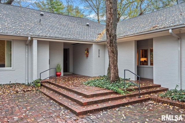 entrance to property featuring a patio