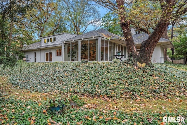 view of front of property featuring a sunroom