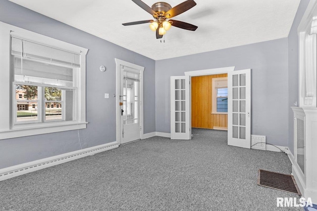 interior space featuring french doors, a baseboard radiator, and ceiling fan