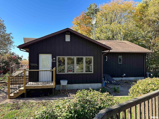 back of property with a wooden deck