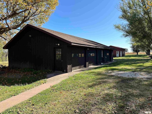 view of side of home with a lawn