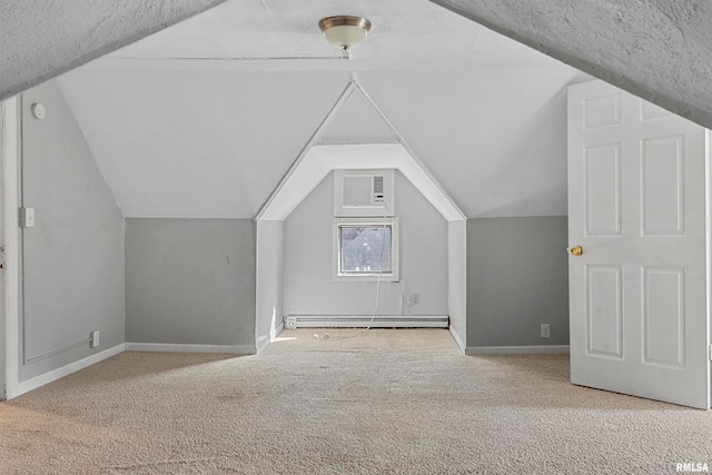 bonus room with light carpet, a textured ceiling, lofted ceiling, and baseboard heating