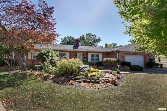 ranch-style home featuring a front lawn and a garage