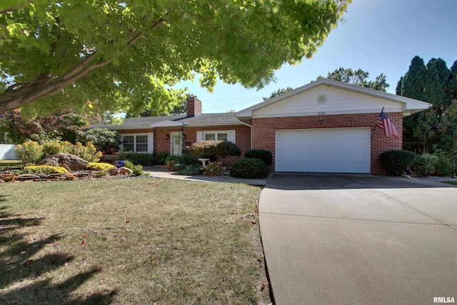 ranch-style home with a front yard and a garage