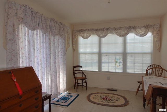 living area featuring tile patterned flooring