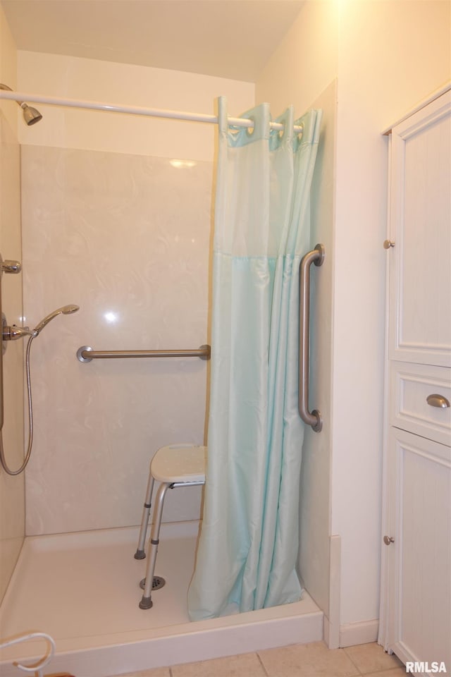 bathroom featuring a shower with curtain and tile patterned flooring