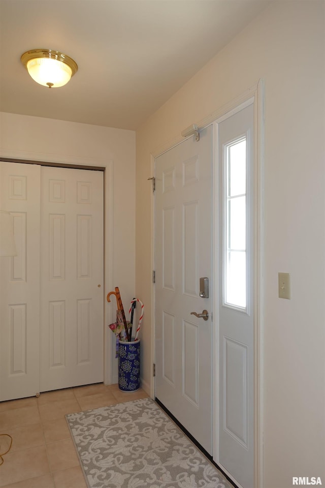 entrance foyer featuring light tile patterned floors