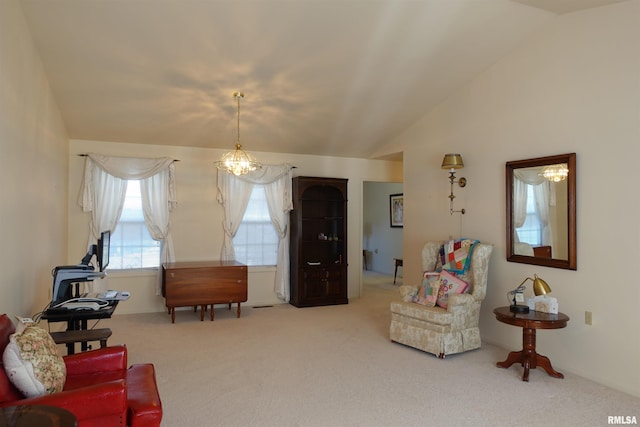 sitting room featuring carpet, a chandelier, and vaulted ceiling