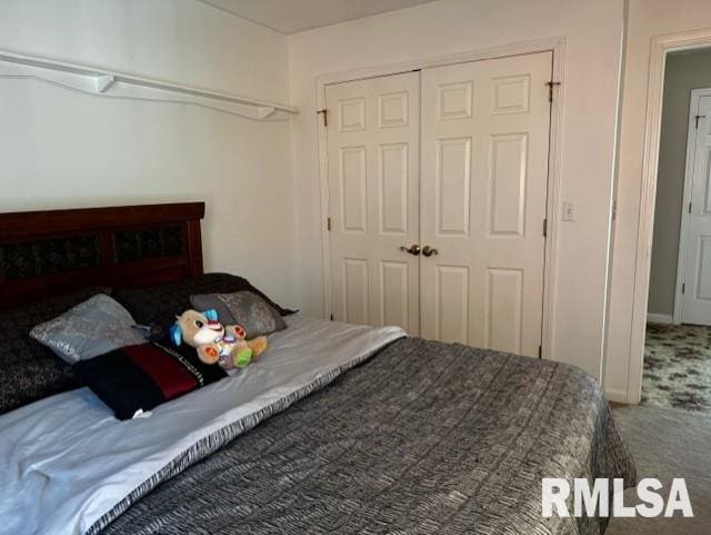 bedroom with carpet floors and a closet