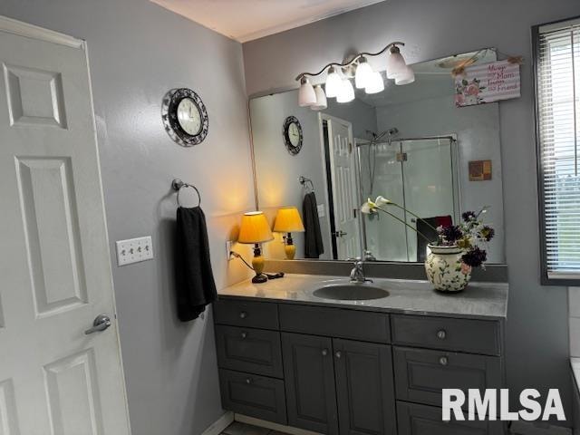 bathroom featuring vanity and walk in shower