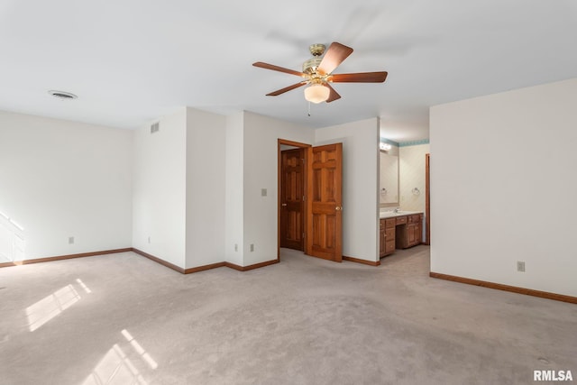 carpeted empty room with ceiling fan