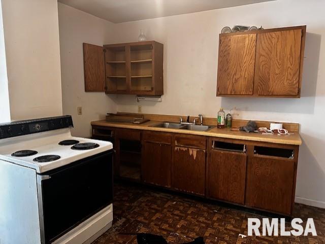 kitchen featuring white electric stove and sink