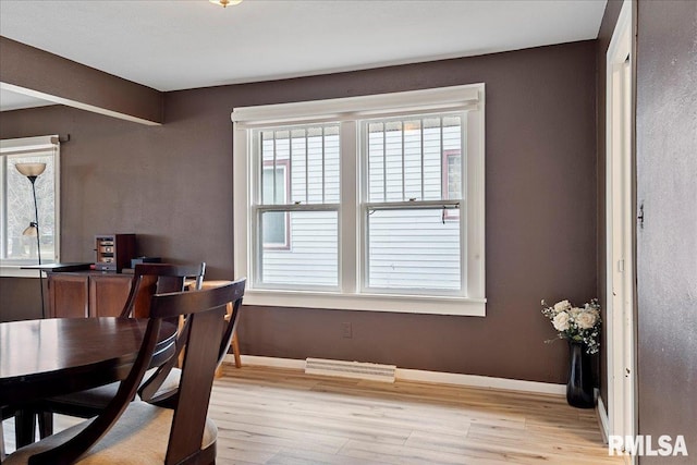 dining space featuring light wood-type flooring