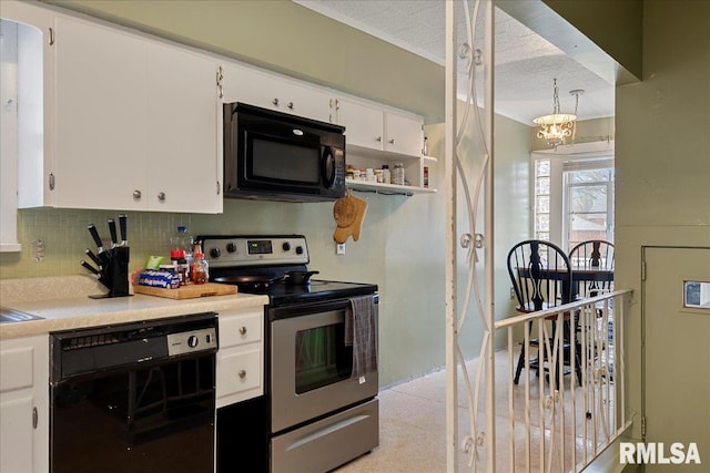 kitchen with white cabinetry, tasteful backsplash, black appliances, and an inviting chandelier