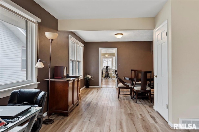 office area with light hardwood / wood-style floors