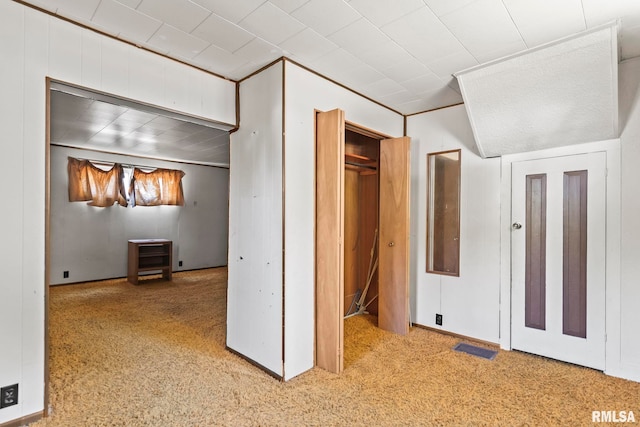 unfurnished bedroom featuring light carpet