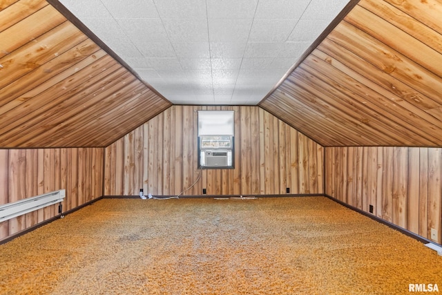 additional living space with lofted ceiling, wooden walls, and carpet flooring