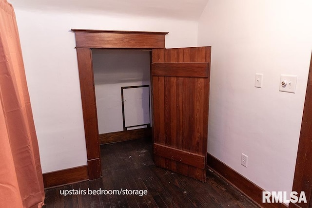 corridor with dark hardwood / wood-style floors