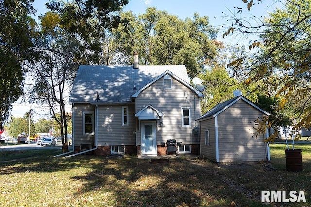 back of house with a yard